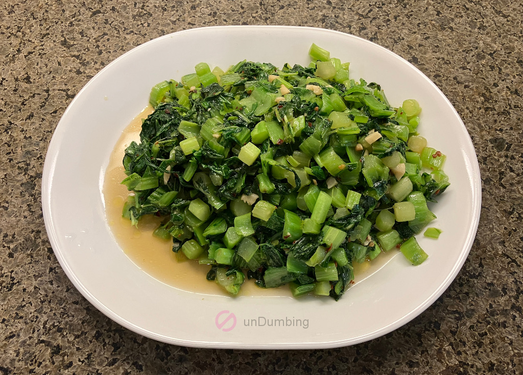 Stir-fried Mustard Greens (Sher Li Hon) on a white plate (Try 2)
